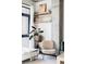 Comfortable, inviting living room featuring a concrete pillar and shelves filled with books and decor at 2100 16Th St # 405, Denver, CO 80202