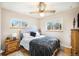 Bedroom featuring hardwood floors, windows for natural light, and warm neutral paint at 12323 W Connecticut Dr, Lakewood, CO 80228