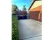 Long driveway with space for multiple cars, plus a detached garage and trash receptacles for convenience at 12323 W Connecticut Dr, Lakewood, CO 80228