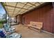 Covered outdoor patio with bench seating, offering a peaceful place to relax outside at 12323 W Connecticut Dr, Lakewood, CO 80228