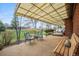 Relaxing covered outdoor patio with seating and open yard view, perfect for entertaining and enjoying the outdoors at 12323 W Connecticut Dr, Lakewood, CO 80228
