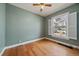 Cozy bedroom with natural light, a ceiling fan and hardwood floors at 3420 Julian St, Denver, CO 80211