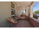 Inviting front porch featuring slate floors and sitting area with view of quiet neighborhood street at 3420 Julian St, Denver, CO 80211