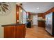Efficient kitchen featuring wood cabinets, modern appliances, and a convenient layout at 3420 Julian St, Denver, CO 80211