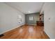 Bright living room featuring hardwood floors and a stylish accent wall at 3420 Julian St, Denver, CO 80211