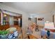Open living space showcases hardwood floors, bright natural light and seamless flow at 3420 Julian St, Denver, CO 80211