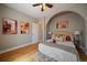 Serene bedroom featuring an arched entry and stylish decor creating a relaxing retreat at 3420 Julian St, Denver, CO 80211