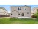 Spacious backyard features a well-manicured lawn and patio, perfect for entertaining at 10158 Granby St, Commerce City, CO 80022