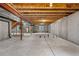 Spacious unfinished basement with concrete foundation and exposed ceiling at 10158 Granby St, Commerce City, CO 80022