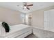 Bedroom with carpet floors, a ceiling fan, and a walk-in closet at 10158 Granby St, Commerce City, CO 80022