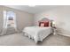 Comfortable bedroom with carpet floors, a double bed, and bright natural light at 10158 Granby St, Commerce City, CO 80022
