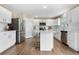 Beautiful kitchen with stainless steel appliances, white cabinetry, and island seating at 10158 Granby St, Commerce City, CO 80022