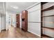 Bright walk-in closet with custom shelving and a view into the ensuite bathroom at 10158 Granby St, Commerce City, CO 80022