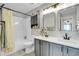 Bathroom featuring double sinks, modern fixtures, and combined shower and tub at 10521 Taylor Ave, Firestone, CO 80504
