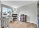 Bedroom featuring wood floors, neutral colors, and natural light at 10521 Taylor Ave, Firestone, CO 80504