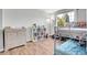 bedroom with hardwood floors, bunk bed with slide, and natural light at 10521 Taylor Ave, Firestone, CO 80504
