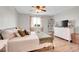 Charming bedroom featuring natural light, wood floors, and calming neutral decor at 10521 Taylor Ave, Firestone, CO 80504