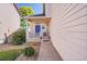 Inviting front porch with a vibrant blue door, welcome sign, and decorative American flag at 10521 Taylor Ave, Firestone, CO 80504