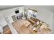 A birds eye view of a comfortable living room with barn-door fireplace and lots of light at 10521 Taylor Ave, Firestone, CO 80504