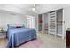 Bright bedroom with closet space featuring a ceiling fan, a window, and hardwood floors at 1121 Albion St # 210, Denver, CO 80220