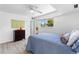 Bright bedroom featuring a ceiling fan, a window, and hardwood floors at 1121 Albion St # 210, Denver, CO 80220