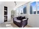Bright living room with floor-to-ceiling windows, modern lighting, and hardwood floors at 1121 Albion St # 210, Denver, CO 80220