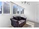 Bright living room with large windows, modern lighting, and hardwood floors at 1121 Albion St # 210, Denver, CO 80220