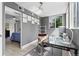 Cozy office space with sleek glass desk, stylish chair, and unique wall decor at 1121 Albion St # 210, Denver, CO 80220