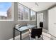 Efficient office space with natural light, glass desk, and convenient layout at 1121 Albion St # 210, Denver, CO 80220
