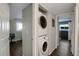 Conveniently located laundry area with modern, stacked washer and dryer units for efficient space saving at 519 Wright St # 108, Lakewood, CO 80228