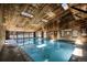 Bright indoor pool features wooden ceiling and skylights, creating a refreshing and inviting recreational space at 519 Wright St # 108, Lakewood, CO 80228