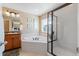 Relaxing bathroom with corner bathtub, shower, and granite vanity at 40 Ferris Ln, Erie, CO 80516