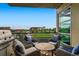 Relaxing balcony with comfortable seating and views of the park and city skyline at 1401 Wewatta St # 308, Denver, CO 80202