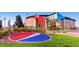 Exterior view of Ball Arena, set amid trees and foliage in an urban environment, showcasing the area's landscape at 1401 Wewatta St # 308, Denver, CO 80202