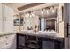Bright bathroom featuring double sinks, stylish lighting fixtures, and modern cabinets for ample storage space at 1401 Wewatta St # 308, Denver, CO 80202