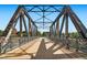View of a pedestrian bridge, showcasing its architectural design and surrounding landscape at 1401 Wewatta St # 308, Denver, CO 80202