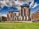 Contemporary apartment buildings with balconies, located next to a green park at 1401 Wewatta St # 308, Denver, CO 80202