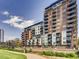 Modern apartment buildings offer balconies and views, set alongside a park at 1401 Wewatta St # 308, Denver, CO 80202