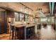 Modern kitchen with stainless steel appliances, bar seating, and exposed brick accents at 1401 Wewatta St # 308, Denver, CO 80202