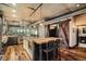 Contemporary kitchen featuring an island with bar seating and rustic barn-style doors at 1401 Wewatta St # 308, Denver, CO 80202