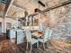 Stylish kitchen and dining area with island seating and modern appliances at 1401 Wewatta St # 308, Denver, CO 80202