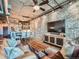 Comfortable living room featuring a leather sofa, brick accents, and an open floor plan at 1401 Wewatta St # 308, Denver, CO 80202
