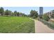 Scenic park pathway with lush greenery, perfect for a peaceful stroll or recreation at 1401 Wewatta St # 308, Denver, CO 80202