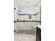 Stylish glass enclosed walk-in shower with bench and marble tiling at 3226 W Dakota Ave, Denver, CO 80219