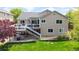 Expansive backyard with a deck, patio, and well-maintained lawn, offering plenty of space for outdoor activities at 14833 Vine St, Thornton, CO 80602