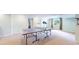 Spacious finished basement featuring ping pong table and view of the bedroom at 14833 Vine St, Thornton, CO 80602
