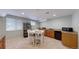 Basement kitchenette features a dining table with seating and additional counter space at 14833 Vine St, Thornton, CO 80602