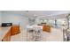Basement kitchenette area features tile floor, cabinets, counter space, and an adjacent dining table at 14833 Vine St, Thornton, CO 80602