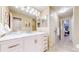 Bathroom with double sink vanity, sleek finishes and ample storage offers convenience at 14833 Vine St, Thornton, CO 80602