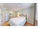 Bedroom features a bed, neutral paint, and closet storage at 14833 Vine St, Thornton, CO 80602